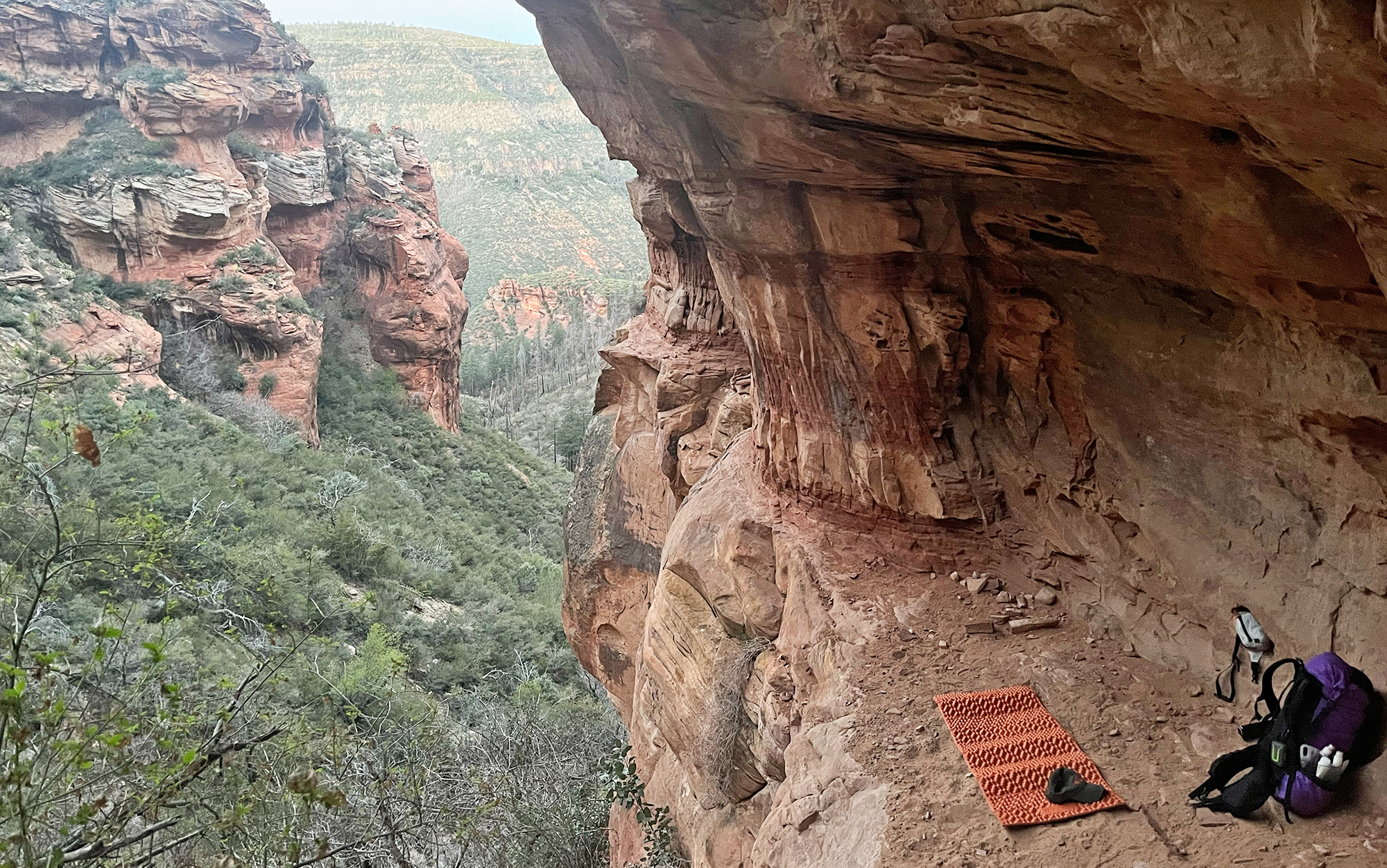 A foam sleeping pad for backpacking sits in a cave.